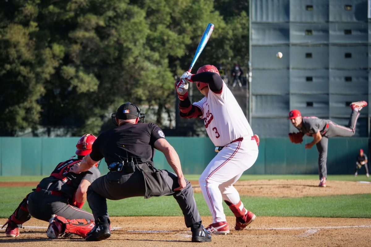 Junior left-handed pitcher Cooper Consiglio throws a breaking ball to sophomore infielder Rintaro Sasaki during the game against Stanford at Klein Field at Sunken Diamond on Friday, May 8, 2026. Consiglio threw six and a third innings, allowing two earned runs. The Wolfpack fell to the Cardinal 6-5. 