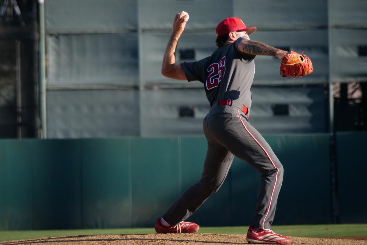 Junior left-handed pitcher Cooper Consiglio throws a pickoff attempt to first base during the game against Stanford at Klein Field at Sunken Diamond on Friday, May 8, 2026. Consiglio threw six and a third innings, allowing two earned runs. The Wolfpack fell to the Cardinal 6-5. 