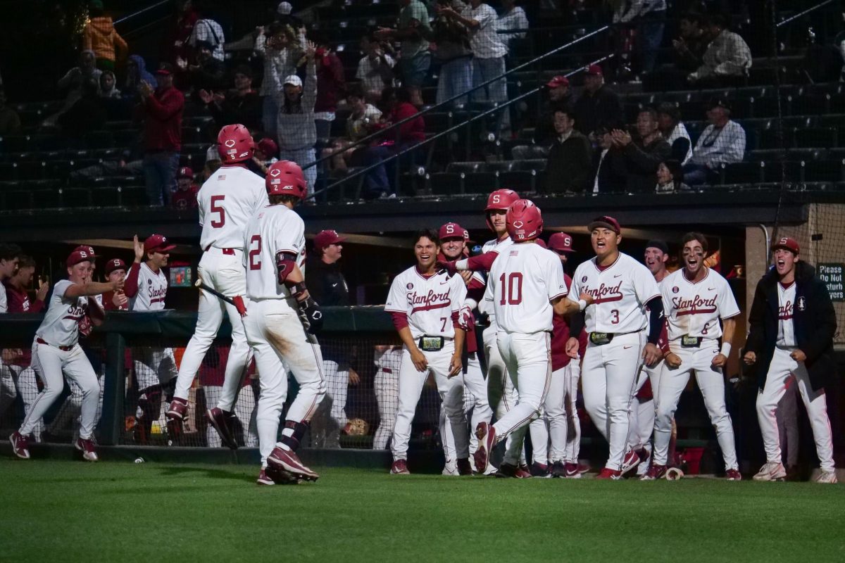 The Cardinal dugout explodes after scoring the go-ahead runs during the game against NC State at Klein Field at Sunken Diamond on Friday, May 8, 2026. The Wolfpack fell to the Cardinal 6-5. 