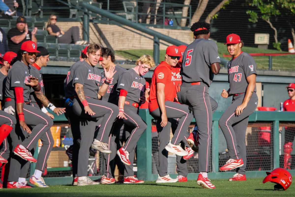 Junior infielder Sherman Johnson celebrates with the dugout after hitting a home run during the game against Stanford at Klein Field at Sunken Diamond on Friday, May 8, 2026. Johnson was 3-for-3 with three RBIs in the game. The Wolfpack fell to the Cardinal 6-5. 