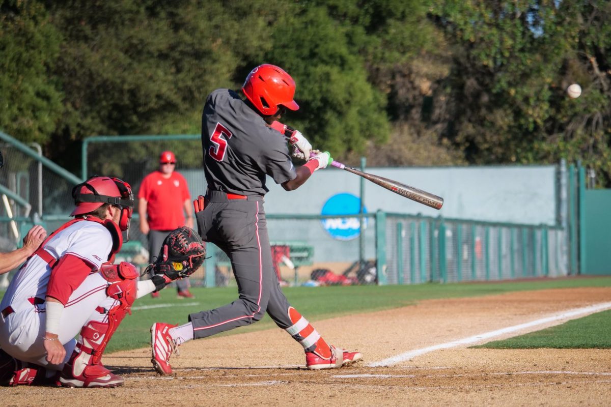 Junior infielder Sherman Johnson clobbers a home run during the game against Stanford at Klein Field at Sunken Diamond on Friday, May 8, 2026. Johnson was 3-for-3 with three RBIs. The Wolfpack fell to the Cardinal 6-5. 
