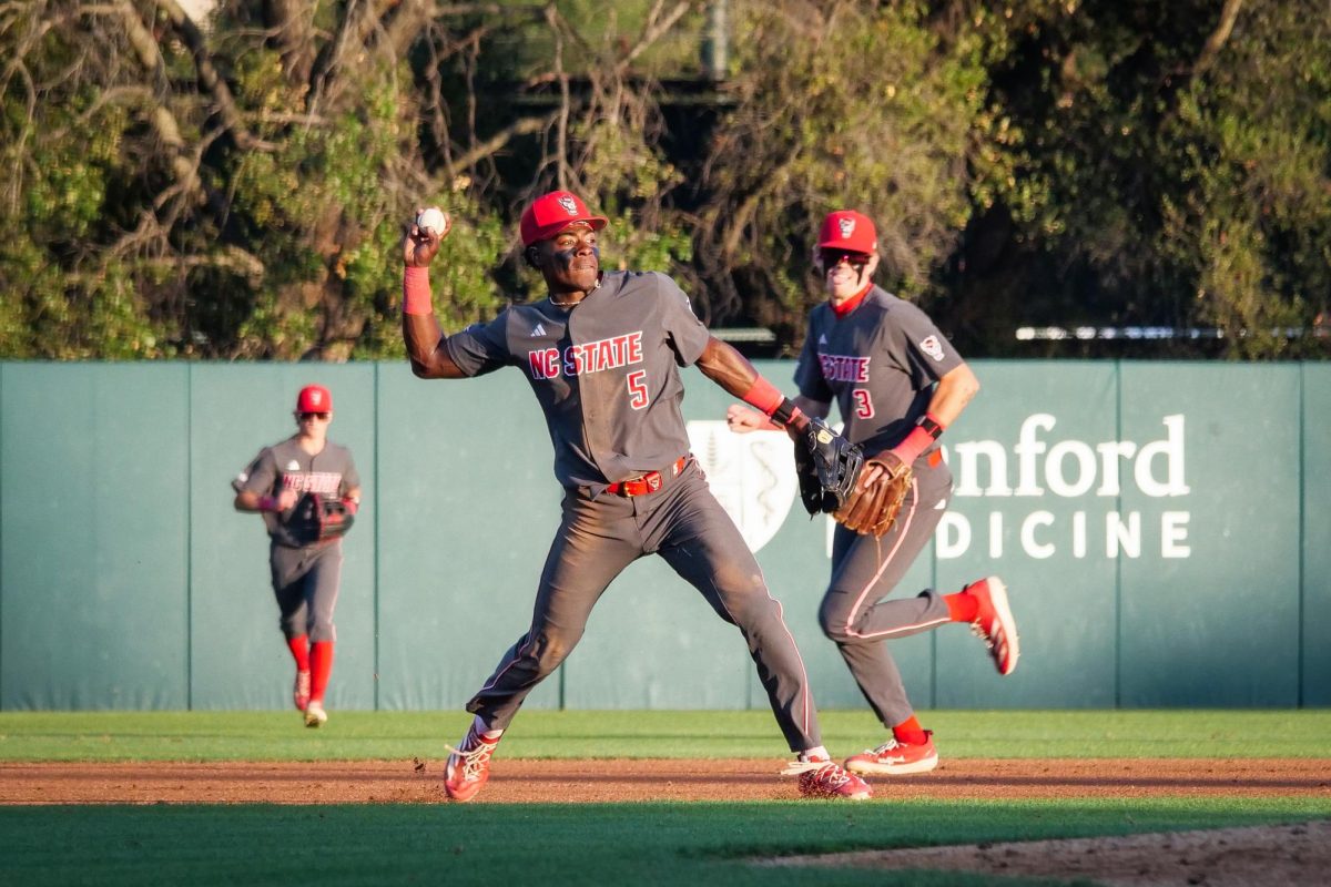 Junior infielder Sherman Johnson fires the ball to first to beat the runner during the game against Stanford at Klein Field at Sunken Diamond on Friday, May 8, 2026. The Wolfpack fell to the Cardinal 6-5. 