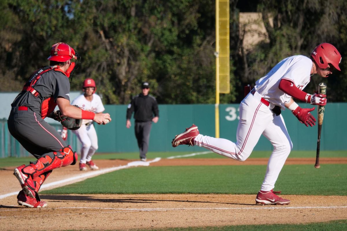 Redshirt junior catcher Drew Lanphere looks the runner back to third before throwing down to first base following a strikeout during the game against Stanford at Klein Field at Sunken Diamond on Friday, May 8, 2026. The Wolfpack fell to the Cardinal 6-5. 