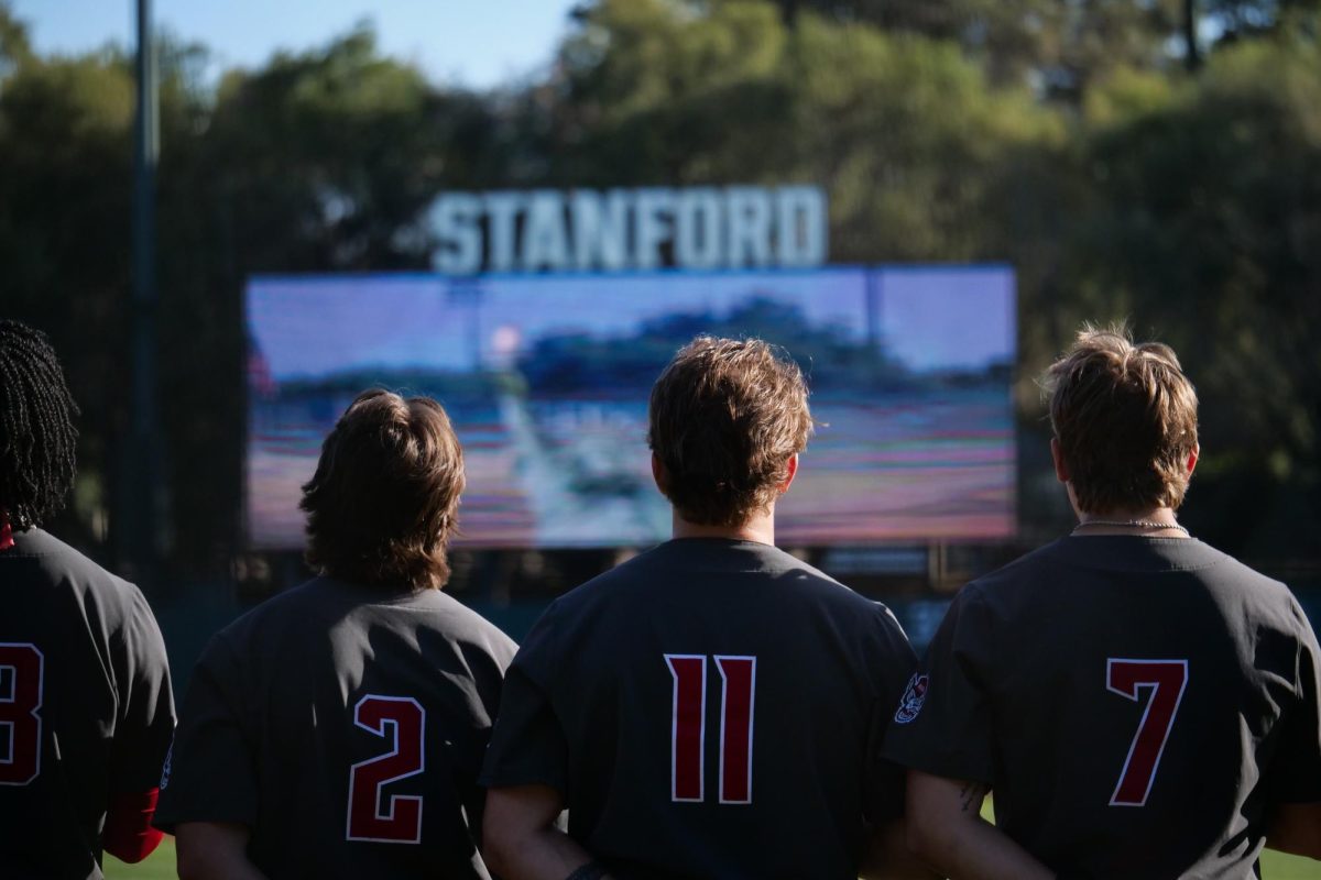 Sophomore infielder Mikey Ryan, redshirt catcher Preston Bonn, senior outfielder Brayden Fraasman stand for the national anthem during the game against Stanford at Klein Field at Sunken Diamond on Friday, May 8, 2026. The Wolfpack fell to the Cardinal 6-5. 