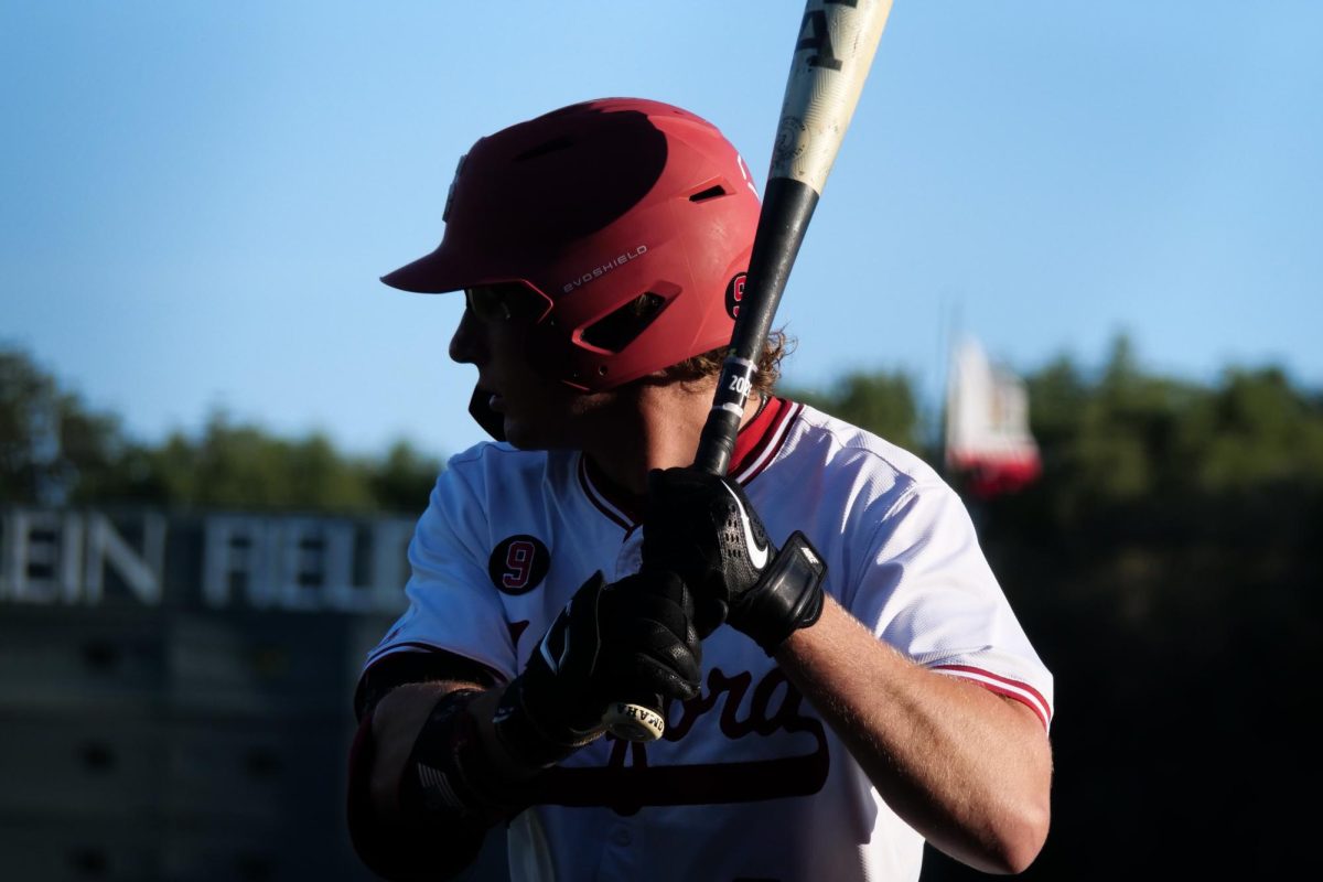 Freshman utility Brock Sell warms up in the on-deck ciricle during the game against NC State at Klein Field at Sunken Diamond on Friday, May 8, 2026. Sell went 2-for-4 in the game. The Wolfpack fell to the Cardinal 6-5. 