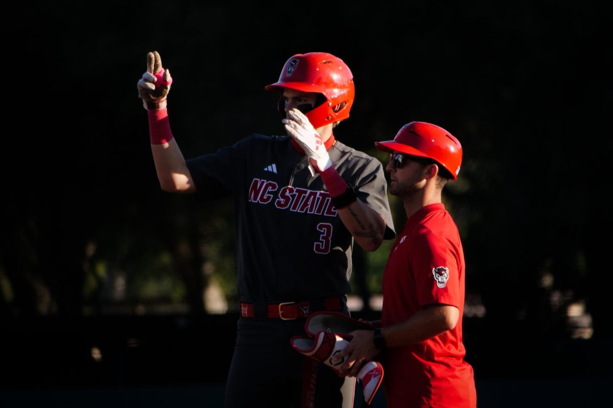 Freshman infielder Christian Serrano motions to the dugout after hitting a single during the game against Stanford at Klein Field at Sunken Diamond on Friday, May 8, 2026. Serrano went 2-for-4 in the game. The Wolfpack fell to the Cardinal 6-5. 