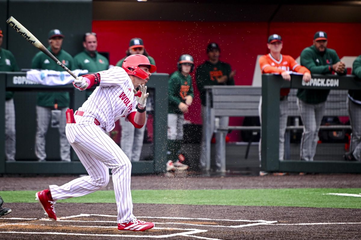 Senior utility Dalton Bargo unleashes a swing during the first game of the doubleheader against Miami in Doak Field at Dail Park on Friday, May 1, 2026. The Wolfpack fell to the Hurricanes 12-9.