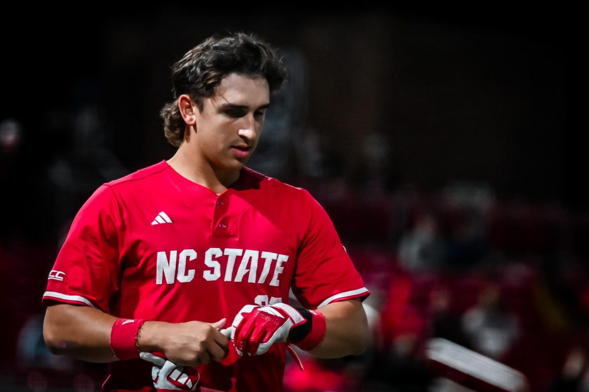 Junior infielder Chris McHugh walks to the dugout during the second game of the doubleheader against Miami in Doak Field at Dail Park on Friday, May 1, 2026. The Wolfpack beat the Hurricanes 13-6.