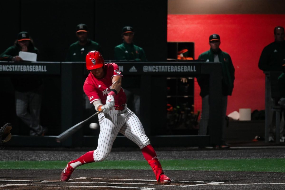 Sophomore infielder Brandon Novy swings for a pitch during the second game of the doubleheader against Miami in Doak Field at Dail Park on Friday, May 1, 2026. Novy scored 2 runs for NC State that game. The Wolfpack beat the Hurricanes 13-6.