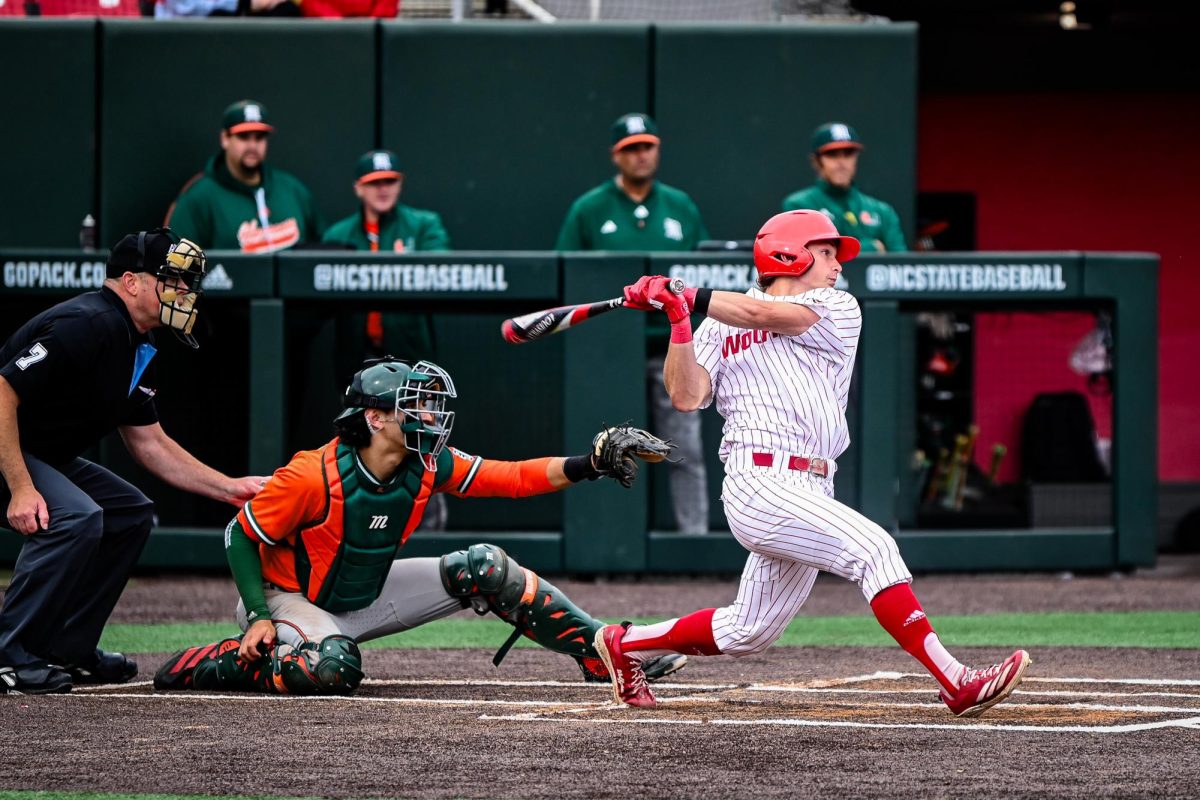 Freshman outfielder Rett Johnson takes a swing during the first game of the doubleheader against Miami in Doak Field at Dail Park on Friday, May 1, 2026. The Hurricanes defeated the Wolfpack 12-9.