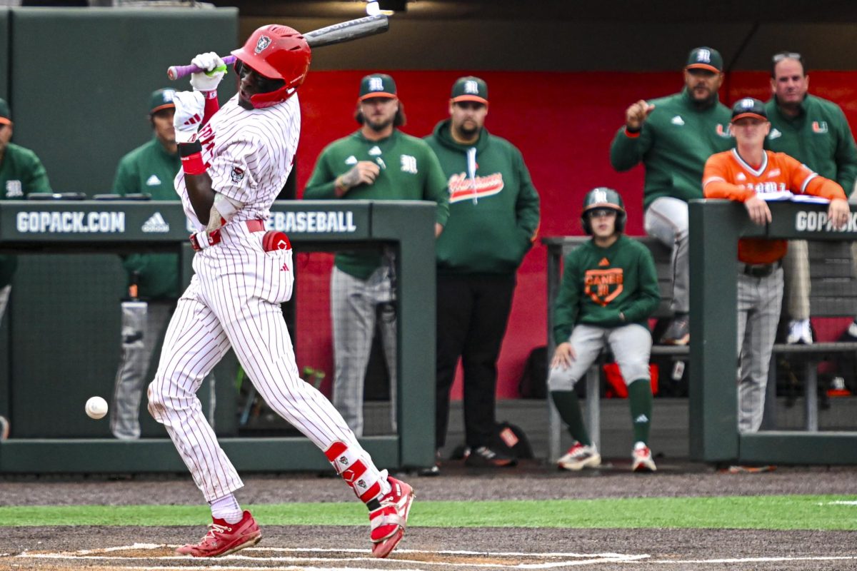 Junior infielder Sherman Johnson gets struck by a pitch during the first game of the doubleheader against Miami in Doak Field at Dail Park on Friday, May 1, 2026. The Wolfpack fell to the Hurricanes 12-9.