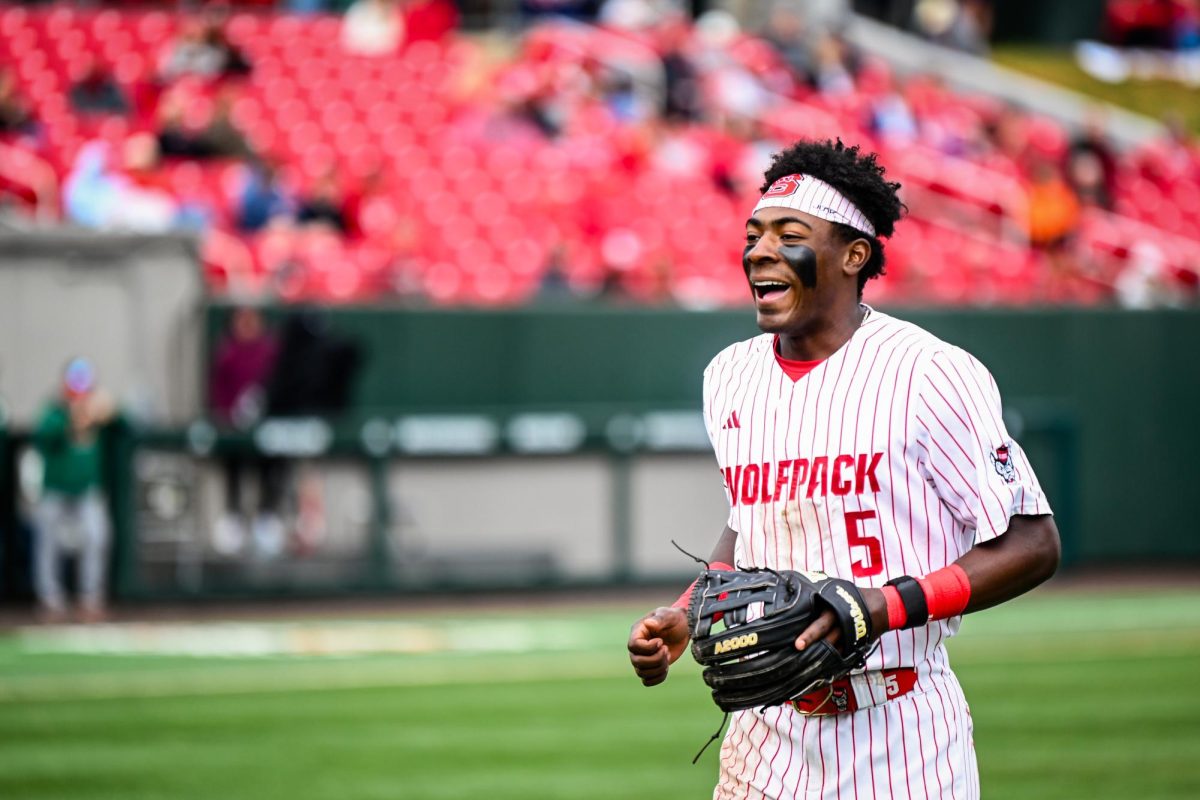 Junior infielder Sherman Johnson celebrates as he returns to the dugout during the first game of the doubleheader against Miami in Doak Field at Dail Park on Friday, May 1, 2026. Johnson recorded two RBIs for NC State. The Hurricanes defeated the Wolfpack 12-9.