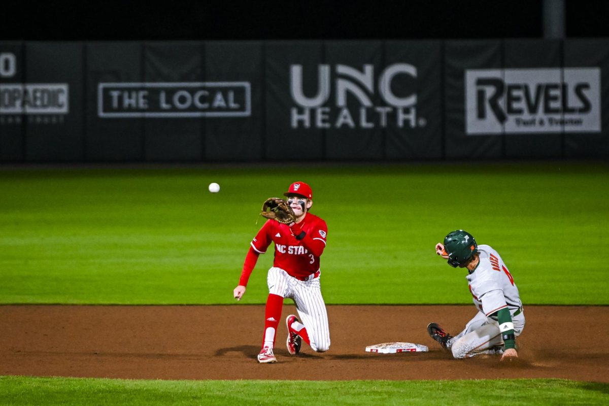 Freshman infielder Christian Serrano catches the ball for the out on second during the second game of the doubleheader against Miami in Doak Field at Dail Park on Friday, May 1, 2026. The runner was called safe on the play. The Wolfpack defeated the Hurricanes 13-6.