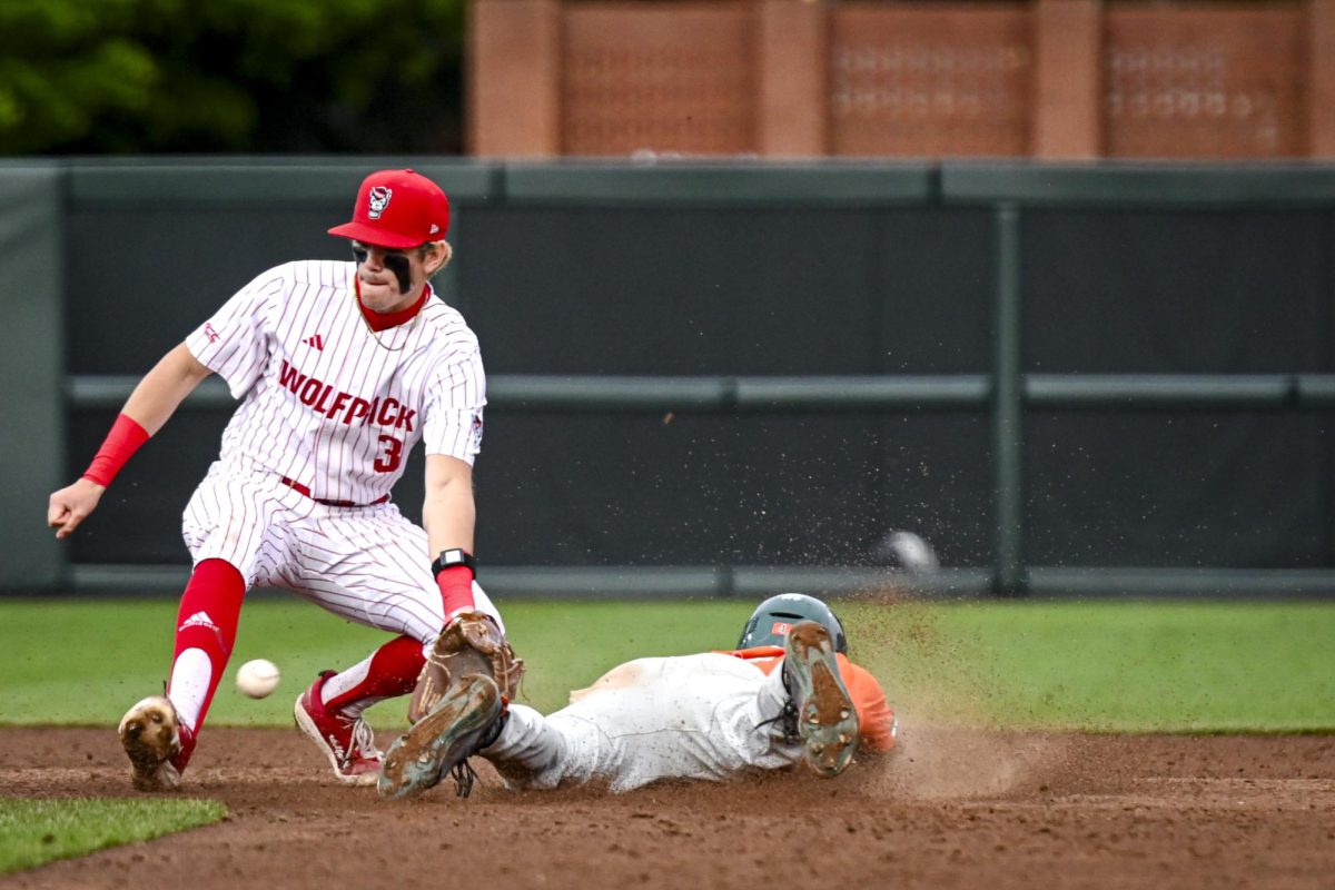 Freshman infielder Christian Serrano catches the ball for the out on second during the first game of the doubleheader against Miami in Doak Field at Dail Park on Friday, May 1, 2026. The runner was called safe on the play. The Wolfpack fell to the Hurricanes 12-9.
