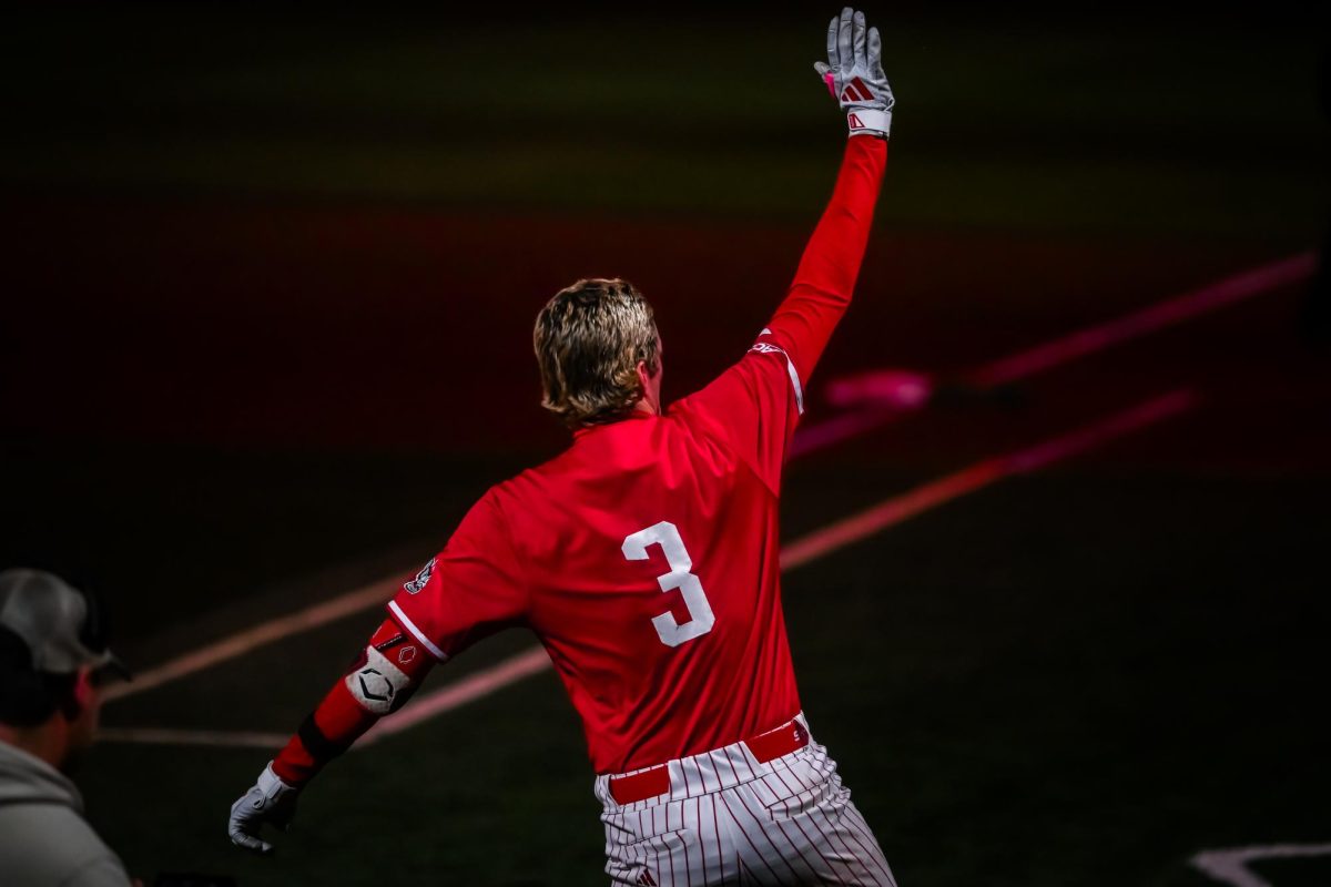 Freshman infielder Christian Serrano returns to the dugout after a home run during the second game of the doubleheader against Miami in Doak Field at Dail Park on Friday, May 1, 2026. Serrano headed the offense with two hits and three runs scored. The Wolfpack beat the Hurricanes 13-6.