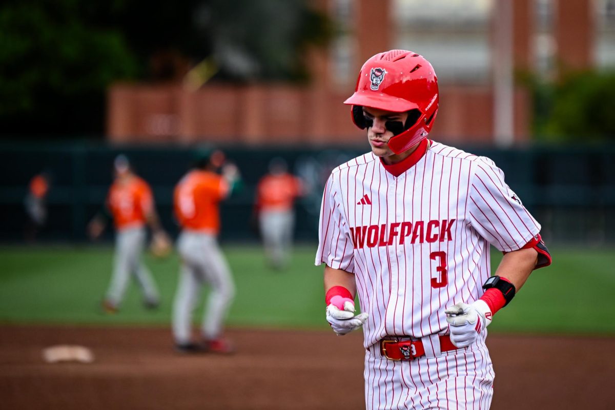 Freshman infielder Christian Serrano runs back to the dugout during the first game of the doubleheader against Miami in Doak Field at Dail Park on Friday, May 1, 2026. Serrano led the team with 3 hits and 2 runs scored. The Hurricanes defeated the Wolfpack 12-9.