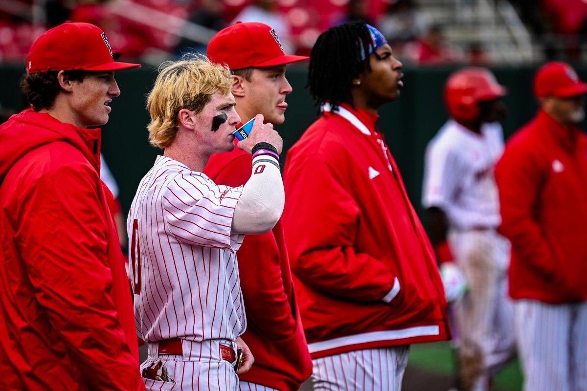 The team watches as the umpires debate during the first game of the doubleheader against Miami in Doak Field at Dail Park on Friday, May 1, 2026. The Hurricanes defeated the Wolfpack 12-9.