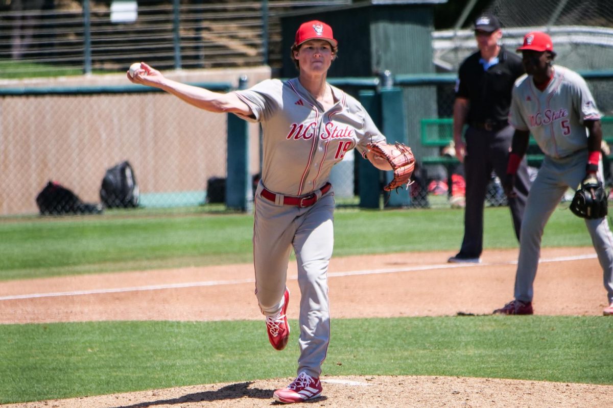 Junior right-handed pitcher Heath Andrews throws a pickoff attempt during the game against Stanford at Klein Field at Sunken Diamond on Sunday, May 10, 2026. Andrews allowed two earned runs in two and two thirds innings pitched. The Cardinal defeated the Wolfpack by a score of 9-5.