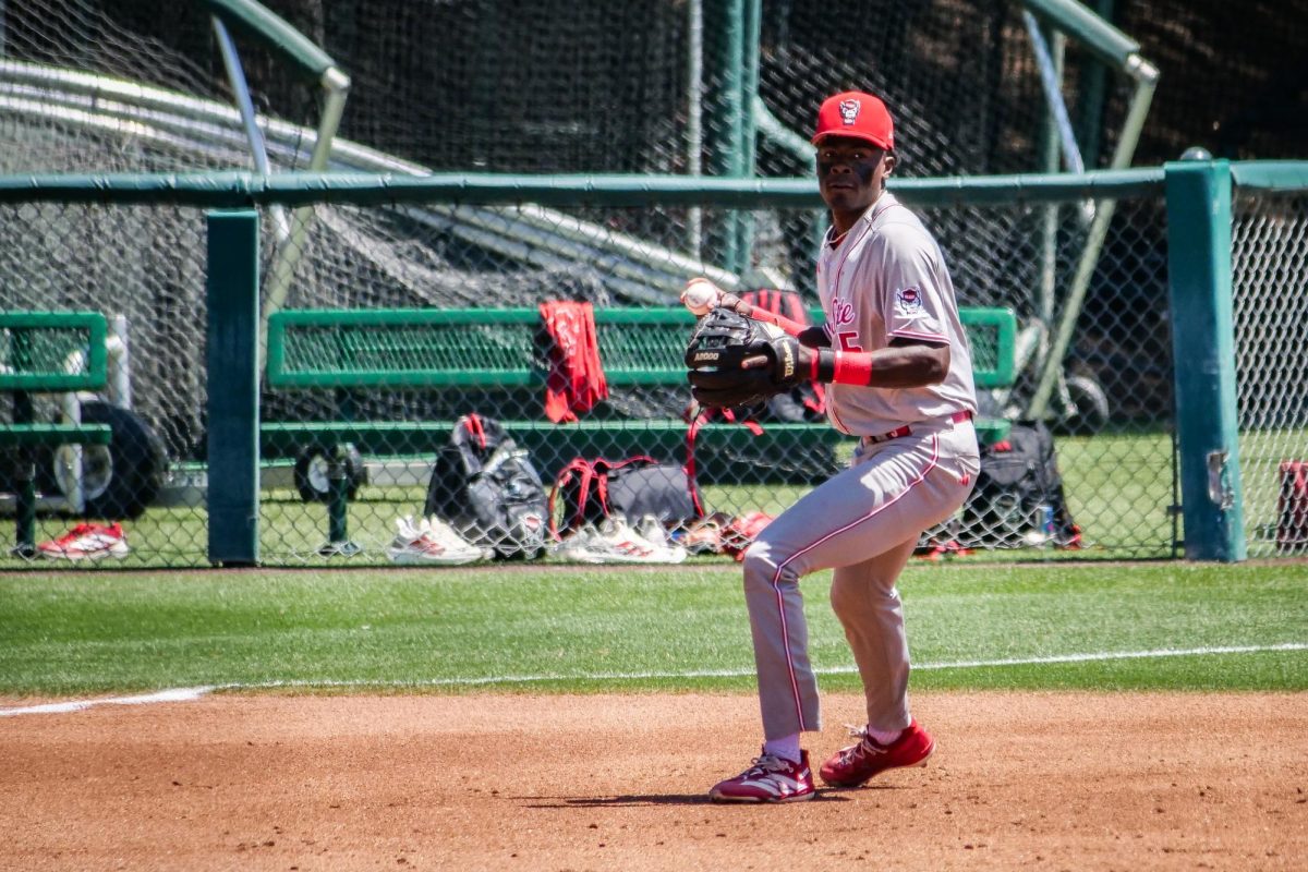 Junior infielder Sherman Johnson collects himself before throwing out a runner at first during the game against Stanford at Klein Field at Sunken Diamond on Sunday, May 10, 2026. The Cardinal defeated the Wolfpack by a score of 9-5.