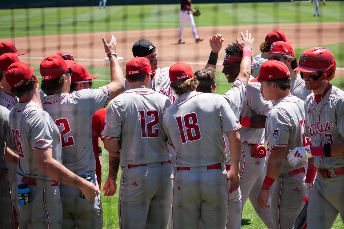 The dugout congratulates junior infielder Sherman Johnson after hitting a homerun during the game against Stanford at Klein Field at Sunken Diamond on Sunday, May 10, 2026. Johnson recorded two RBIs in the game. The Cardinal defeated the Wolfpack by a score of 9-5.
