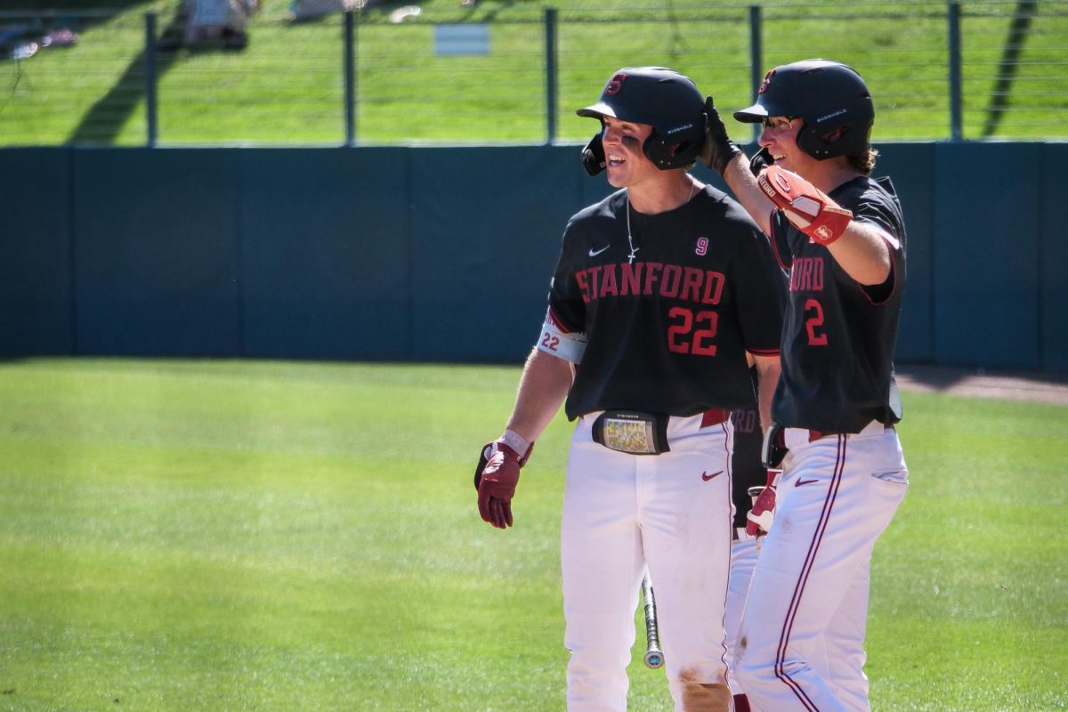 Senior outfielder Cort MacDonald and freshman utility Brock Sell celebrate as they wait for freshman infielder Teddy Tokheim to round the bases after hitting a home run during the game against NC State at Klein Field at Sunken Diamond on Sunday, May 10, 2026. The Cardinal defeated the Wolfpack by a score of 9-5.