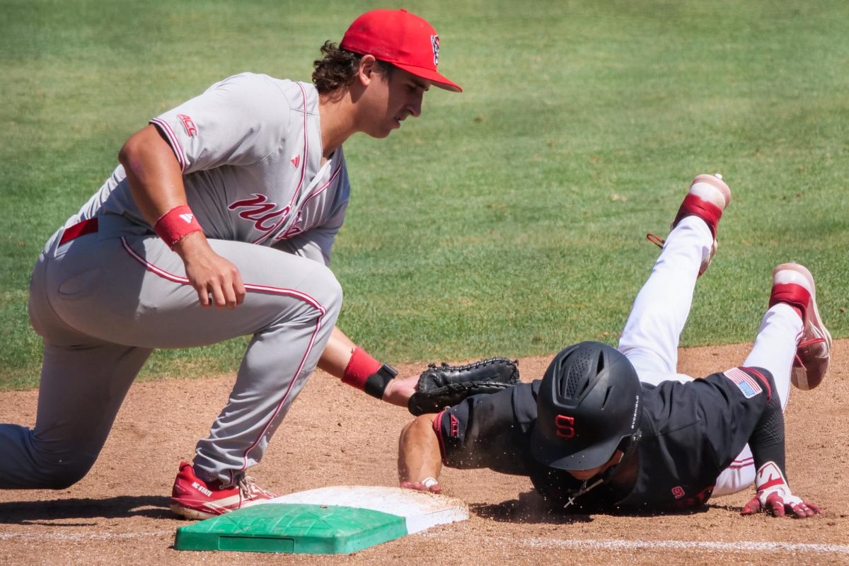 Junior infielder Chris McHugh plants a tag during a pickoff attempt during the game against Stanford at Klein Field at Sunken Diamond on Sunday, May 10, 2026. The Cardinal defeated the Wolfpack by a score of 9-5.