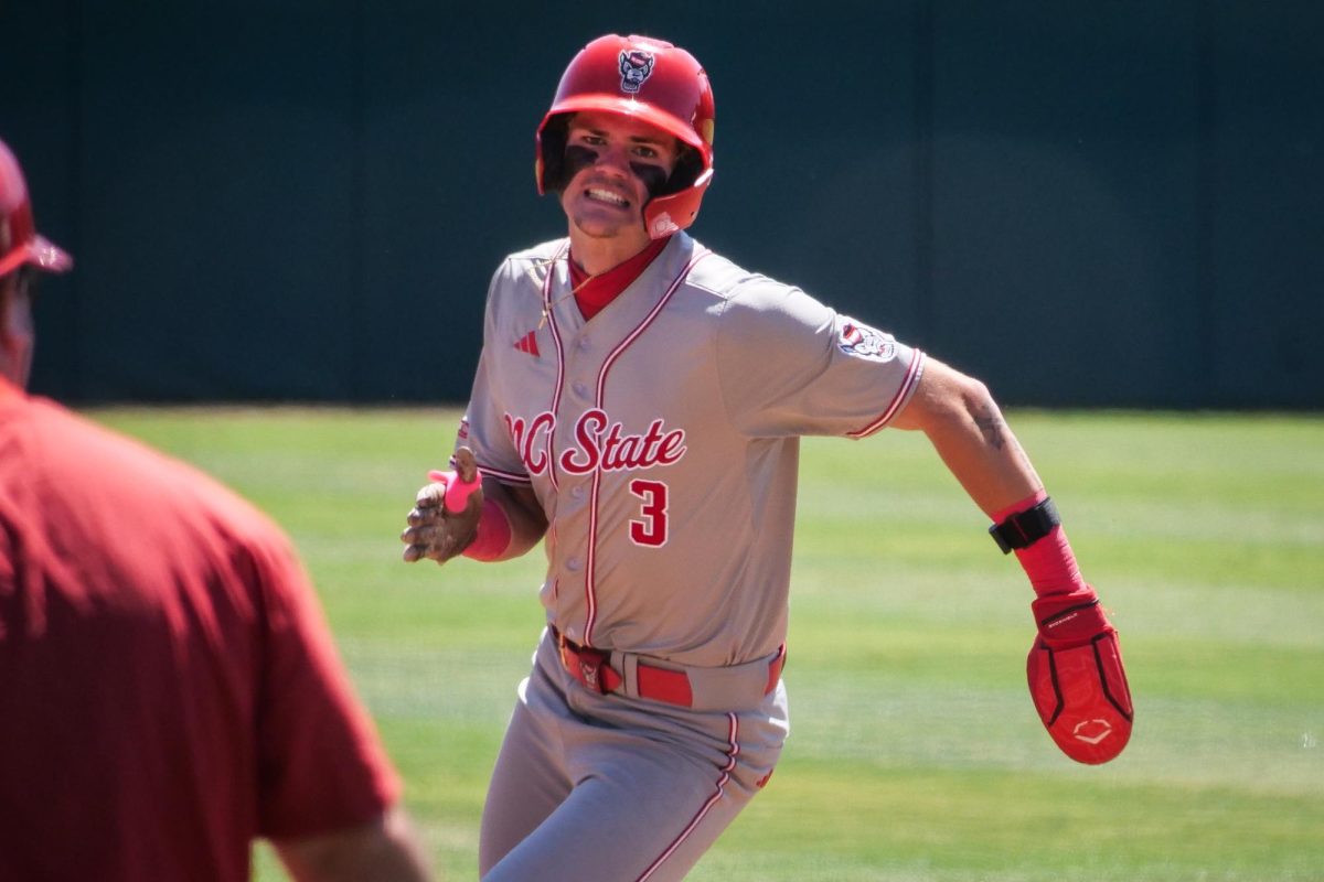 Freshman infielder Christian Serrano digs around third base during the game against Stanford at Klein Field at Sunken Diamond on Sunday, May 10, 2026. Serrano went 2-for-4 in the game. The Cardinal defeated the Wolfpack by a score of 9-5.