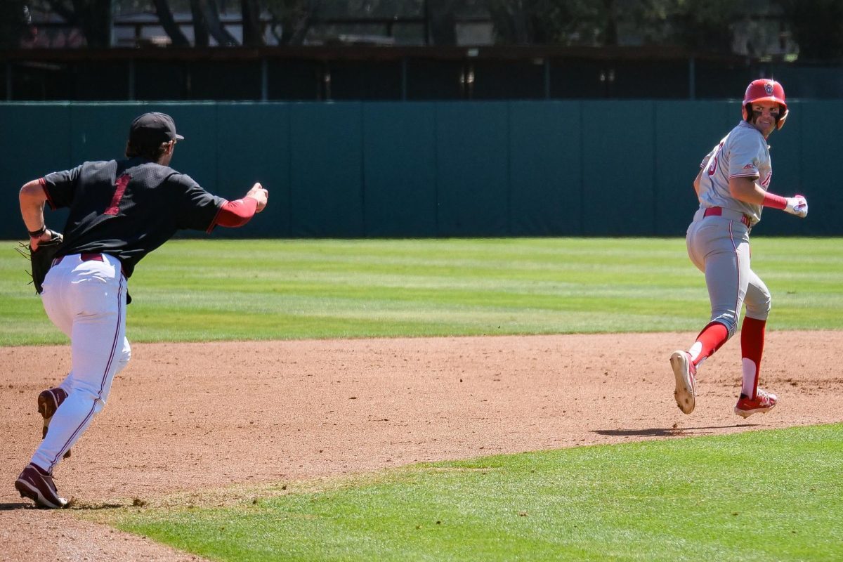 Freshman infielder Christian Serrano gets in a run-down with sophomore infielder JJ Moran during the game against Stanford at Klein Field at Sunken Diamond on Sunday, May 10, 2026. The Cardinal defeated the Wolfpack by a score of 9-5.