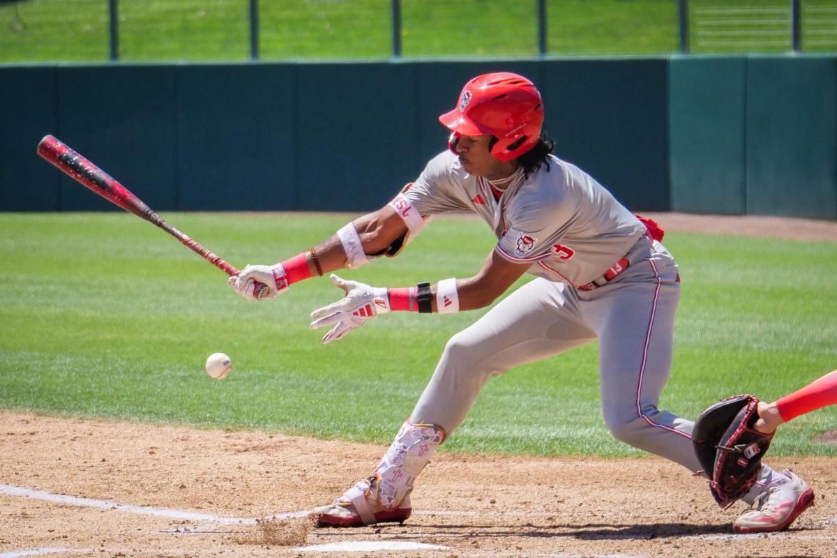 Junior outfielder Andrew Wiggins lunges at a breaking ball during the game against Stanford at Klein Field at Sunken Diamond on Sunday, May 10, 2026. The Cardinal defeated the Wolfpack by a score of 9-5.