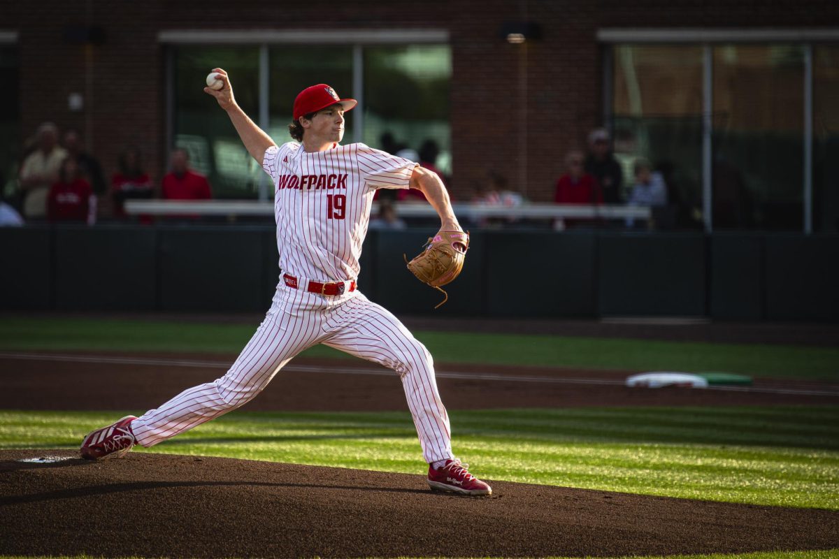 Junior right-handed pitcher Heath Andrews fires a pitch during the game against UNC in Doak Field at Dail Park on Thursday, May 14, 2026. Andrews had a career-high 10 strikeouts. The Tar Heels defeated the Wolfpack 9-4.