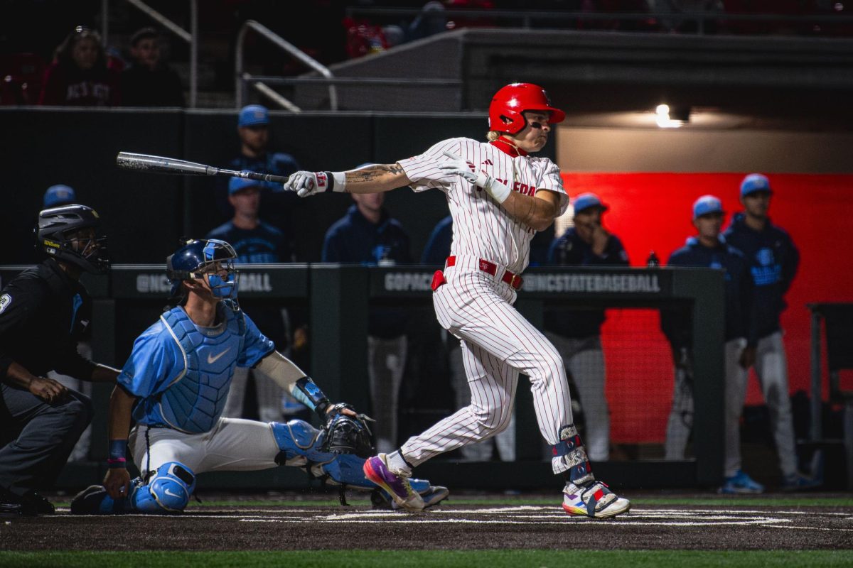 Sophomore outfielder Ty Head follows through on a swing during the game against UNC in Doak Field at Dail Park on Thursday, May 14, 2026. The Tar Heels defeated the Wolfpack 9-4.