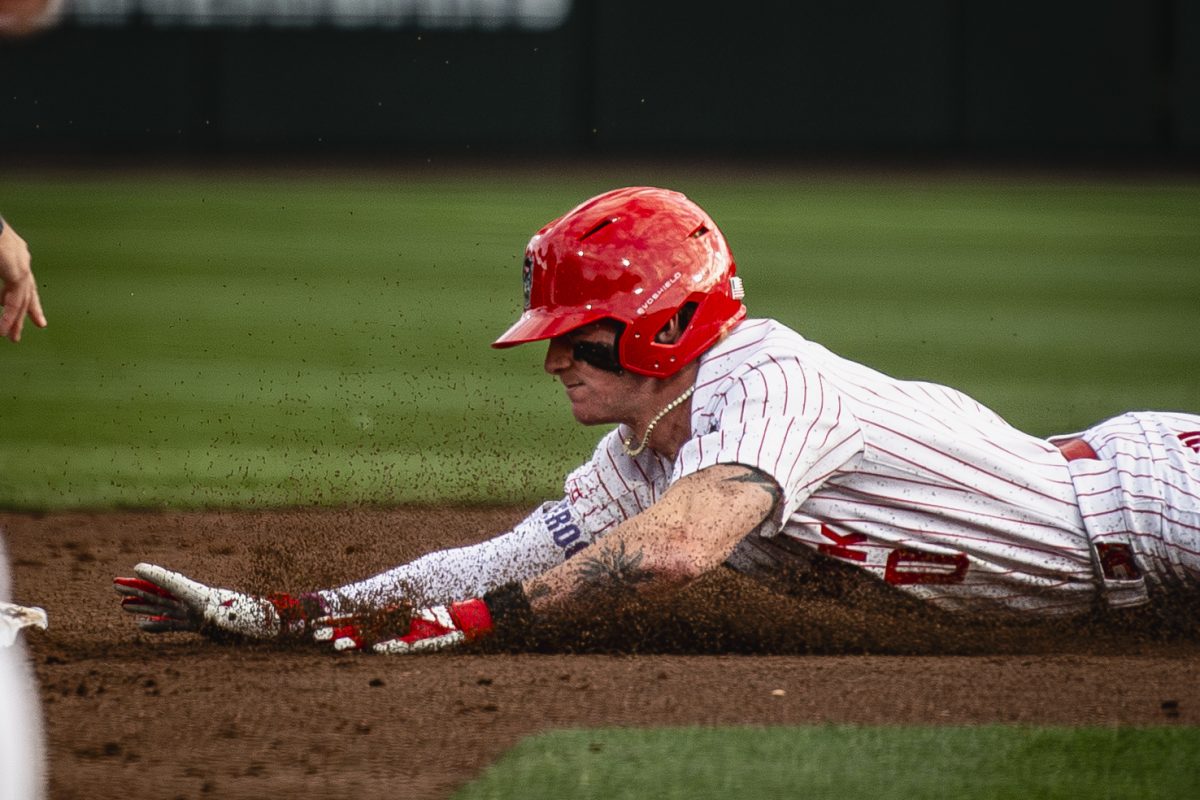 Junior infielder Luke Nixon slides into second during the game against UNC in Doak Field at Dail Park on Thursday, May 14, 2026. The Tar Heels defeated the Wolfpack 9-4.
