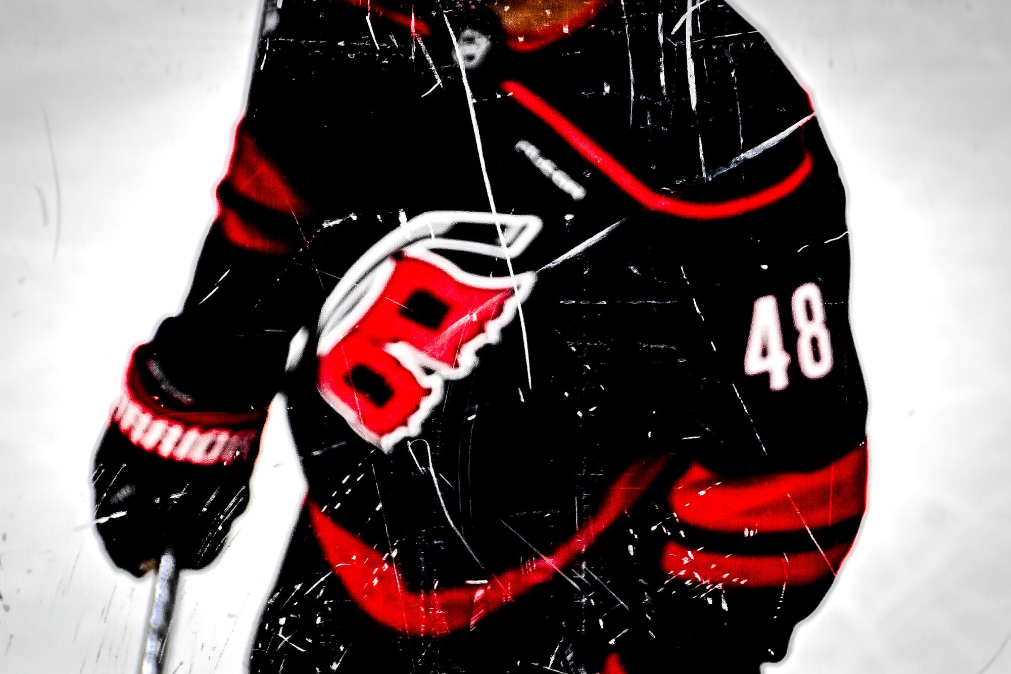 Left wing Jordan Martinook on the other side of the glass during Game One of Round Two in the Eastern Conference Playoffs against the Philadelphia Flyers at the Lenovo Center on Saturday, May. 2, 2026.  The Hurricanes defeated the Flyers 3-0.