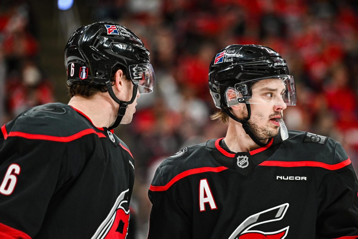 Defenseman Mike Reilly and Center Sebastian Aho plan for the faceoff during Game One of Round Two in the Eastern Conference Playoffs against the Philadelphia Flyers at the Lenovo Center on Saturday, May. 2, 2026.  The Hurricanes defeated the Flyers 3-0.