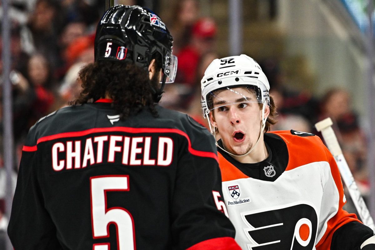 Flyers Center Denver Barkey talks to defenseman Jalen Chatfield during Game One of Round Two in the Eastern Conference Playoffs against the Philadelphia Flyers at the Lenovo Center on Saturday, May. 2, 2026.  The Hurricanes defeated the Flyers 3-0.