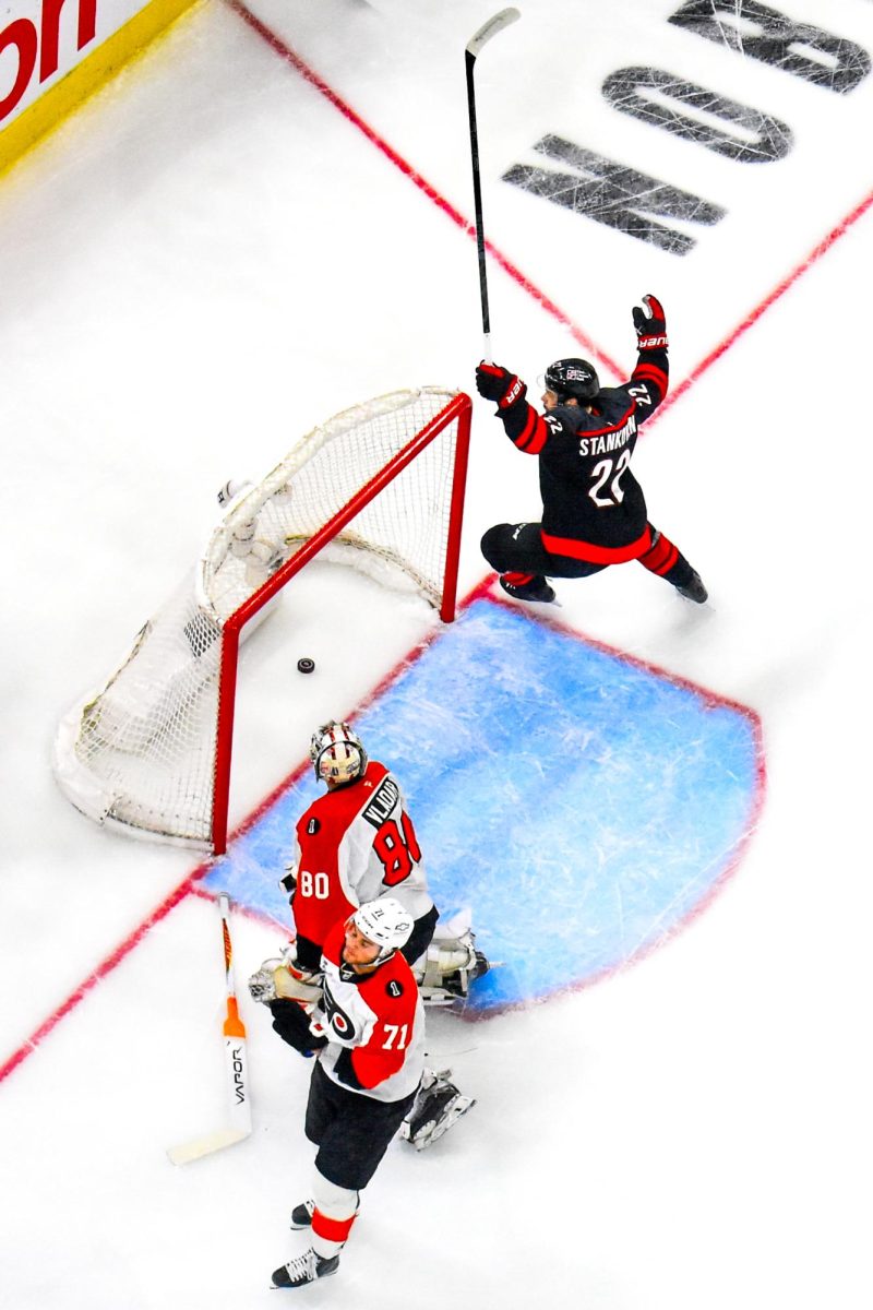 Center Logan Stankoven scores the opening goal for Game One of Round Two in the Eastern Conference Playoffs against the Philadelphia Flyers at the Lenovo Center on Saturday, May. 2, 2026. Stankoven has set the record as the youngest NHL player to start the postseason with a five-game goal streak. The Hurricanes defeated the Flyers 3-0.