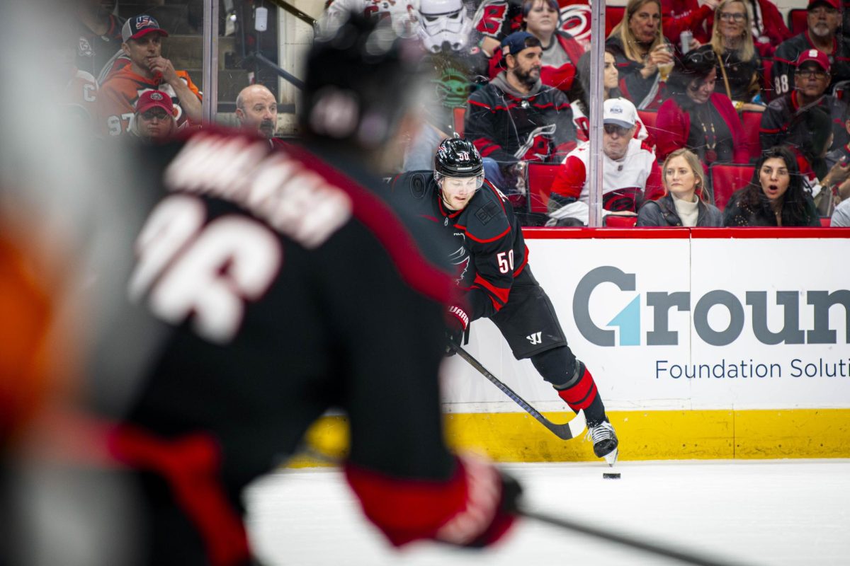 Left-wing Eric Robinson passes the puck during Game Two of the Eastern Conference Semifinals between the Carolina Hurricanes and Philadelphia Flyers in the Lenovo Center on Monday, May 4, 2026. The Hurricanes defeated the Flyers 3-2 in overtime.