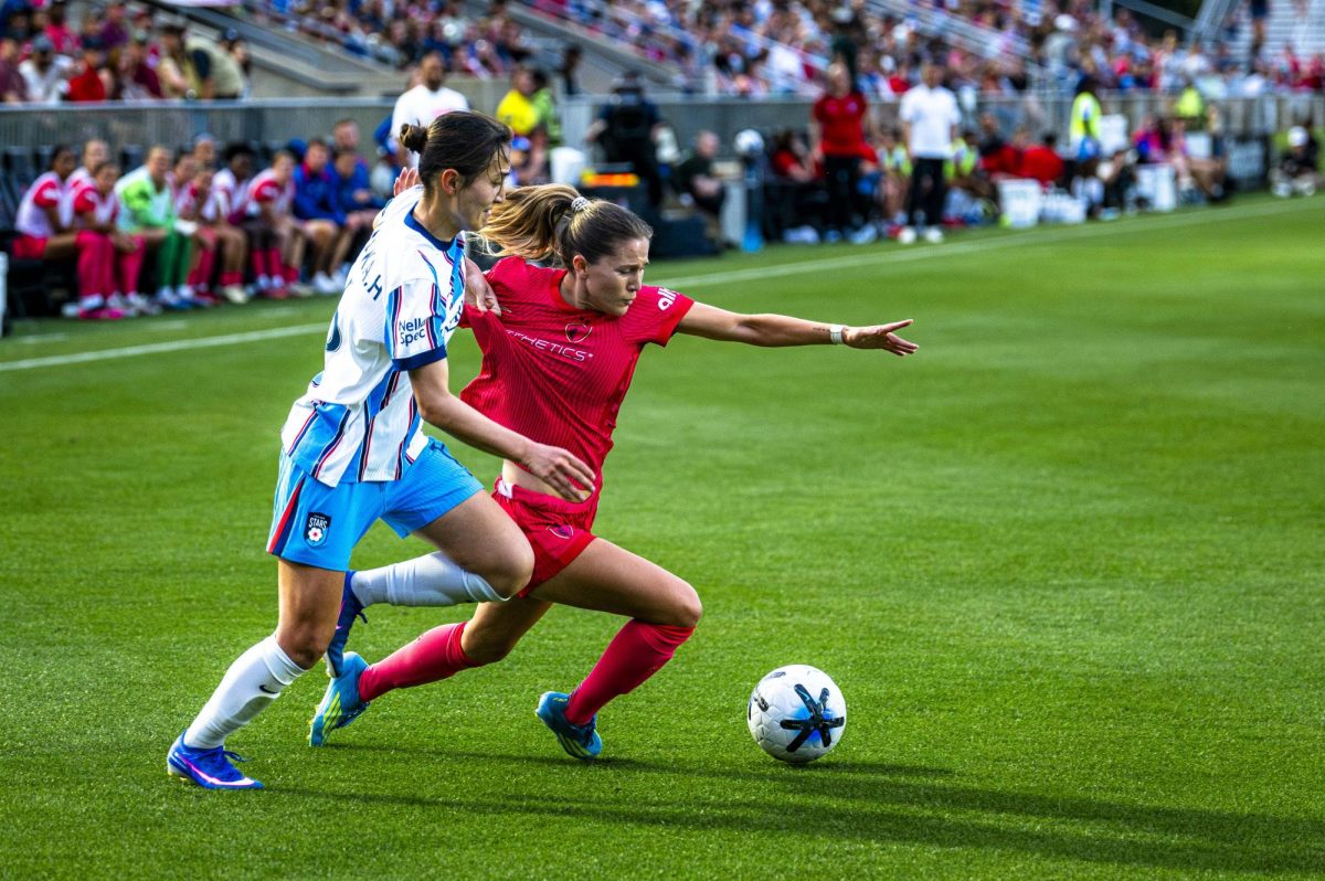 NC Courage FC midfielder Ashley Sanchez (2) is tripped up by Chicago Stars FC midfielder Manaka Hayashi (16) during the game in First Horizon Stadium at WakeMed Soccer Park on Saturday, May 16, 2026. The Courage defeated the Stars 4-0.