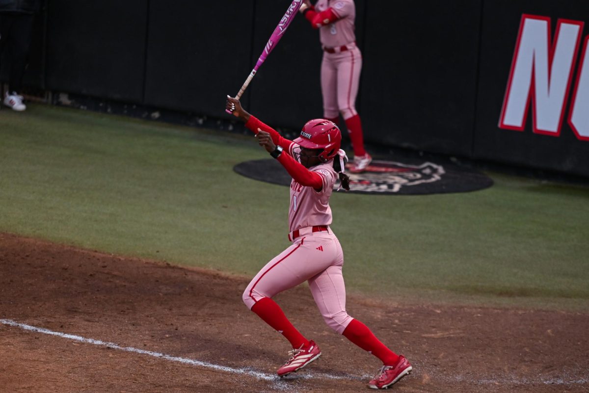 Senior outfielder Maia Townsend hits the ball during the game against Louisville at Dail Softball Stadium on Friday, May 1, 2026. The Wolfpack fell to the Cardinals 5-1.