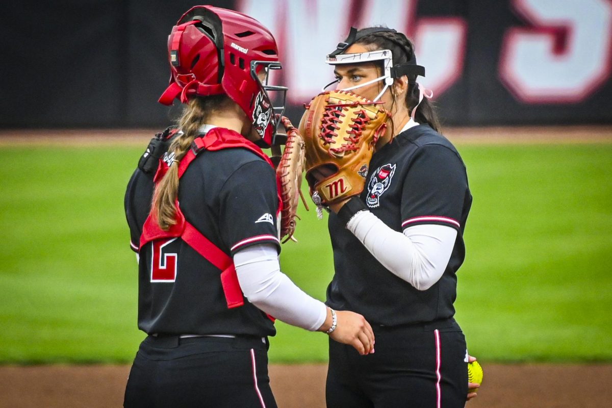 Redshirt-junior right-handed pitcher Wynne Gore and senior catcher Ellington Whitaker talk on the mound during the game against Louisville at Dail Softball Stadium on Saturday, May 2, 2026. Gore threw for three innings. NC State defeated Louisville 10-6.