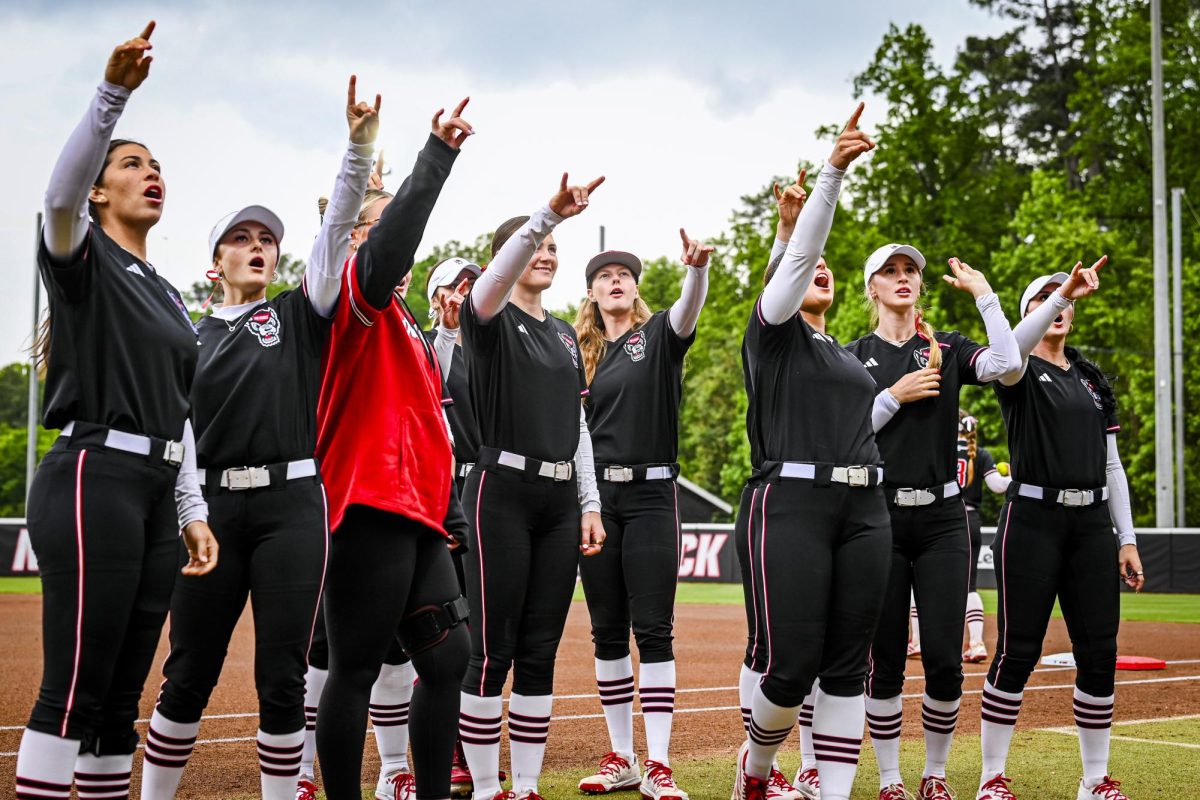 NC State players hype up the crowd during the game against Louisville at Dail Softball Stadium on Saturday, May 2, 2026. NC State defeated Louisville 10-6.