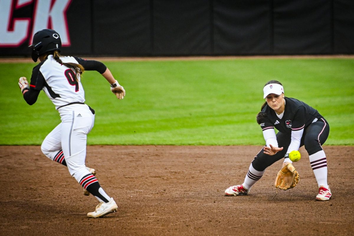 Freshman utility Morgen Talley bends to catch a ground ball during the game against Louisville at Dail Softball Stadium on Saturday, May 2, 2026. NC State defeated Louisville 10-6.
