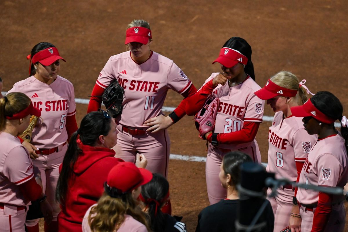 Head Coach Lindsay Leftwich gives a talk during the game against Louisville at Dail Softball Stadium on Friday, May 1, 2026. The Wolfpack fell to the Cardinals 5-1.
