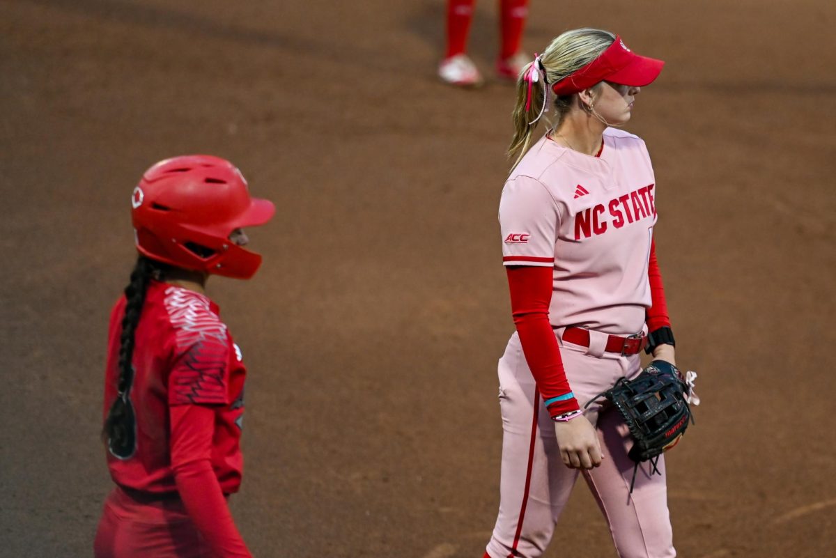 Freshman infielder Lily Livingston awaits the pitch during the game against Louisville at Dail Softball Stadium on Friday, May 1, 2026. The Wolfpack fell to the Cardinals 5-1.