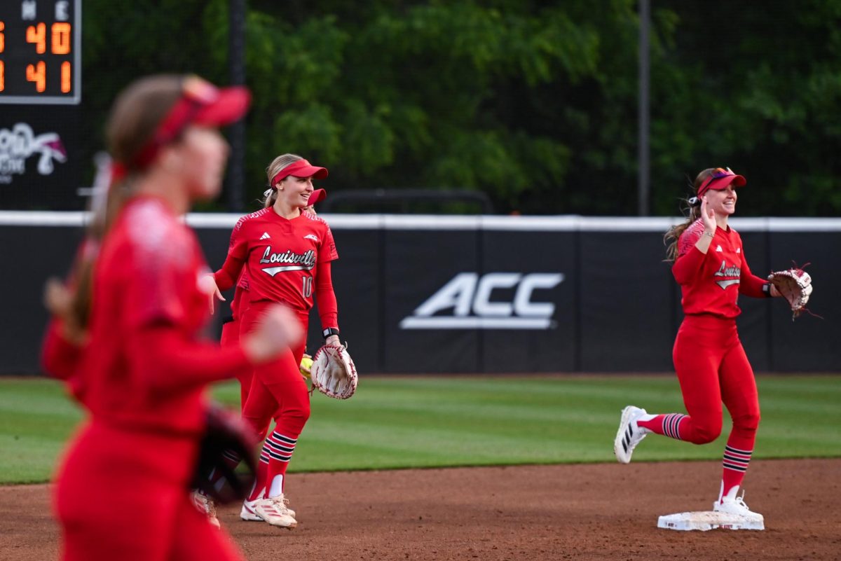 Senior outfielder Chelsea Mack from Louisville celebrates at the end of an inning during the game against Louisville at Dail Softball Stadium on Friday, May 1, 2026. The Wolfpack fell to the Cardinals 5-1.