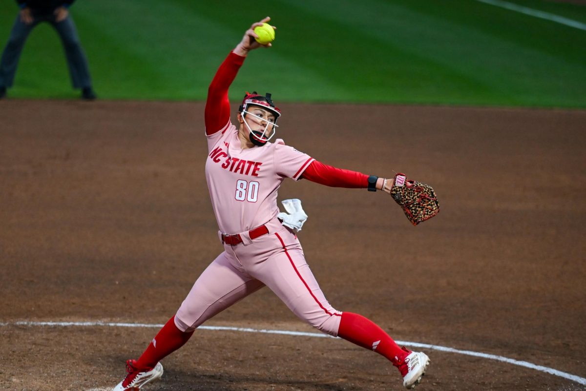 Graduate Student pitcher Charli Orsini pitches during the game against Louisville at Dail Softball Stadium on Friday, May 1, 2026. The Wolfpack fell to the Cardinals 5-1.