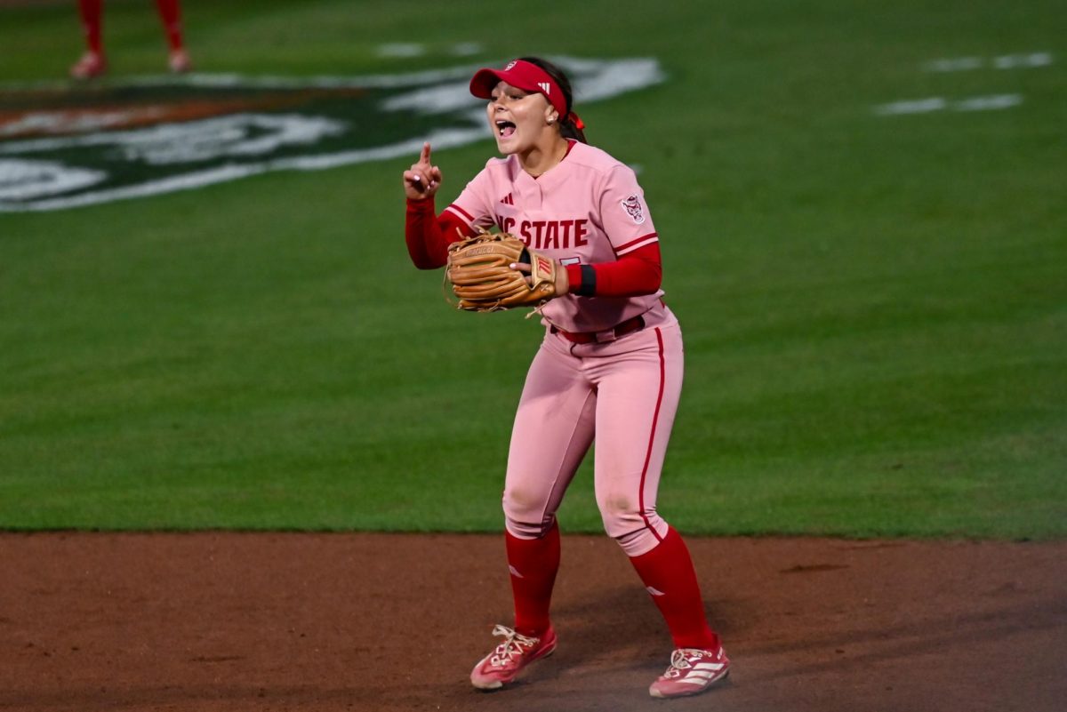 Sophomore infielder Kendall Simmers cheers during the game against Louisville at Dail Softball Stadium on Friday, May 1, 2026. The Wolfpack fell to the Cardinals 5-1.