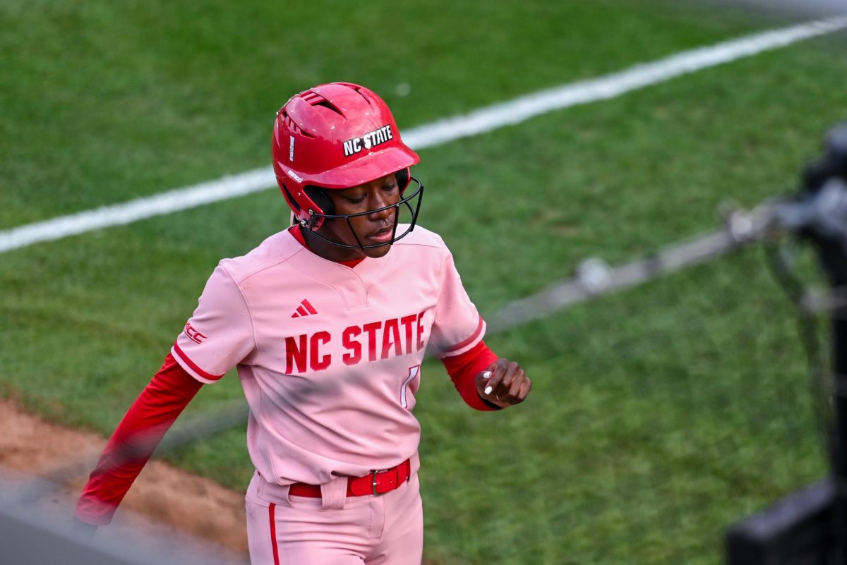 Senior outfielder Maia Townsend walks to the dugout during the game against Louisville at Dail Softball Stadium on Friday, May 1, 2026. The Wolfpack fell to the Cardinals 5-1.