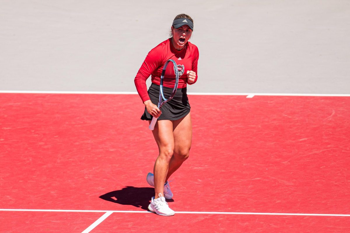 Junior Gabriella Broadfoot pumps her fist after scoring a point during the match against Syracuse at Dail Outdoor Tennis Stadium on Sunday, March 29, 2026. Broadfoot won her singles match (6-4, 6-1). NC State beat Syracuse 7-0.