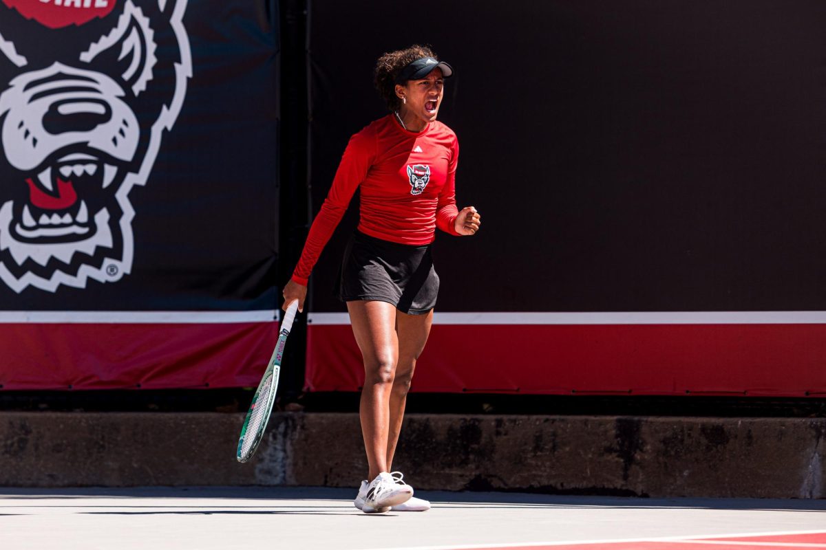 Freshman Victoria Osuigwe yells after after scoring a point during her match against Syracuse at Dail Outdoor Tennis Stadium on Sunday, March 29, 2026. Osuigwe won her singles match (6-1, 6-1). NC State beat Syracuse 7-0.